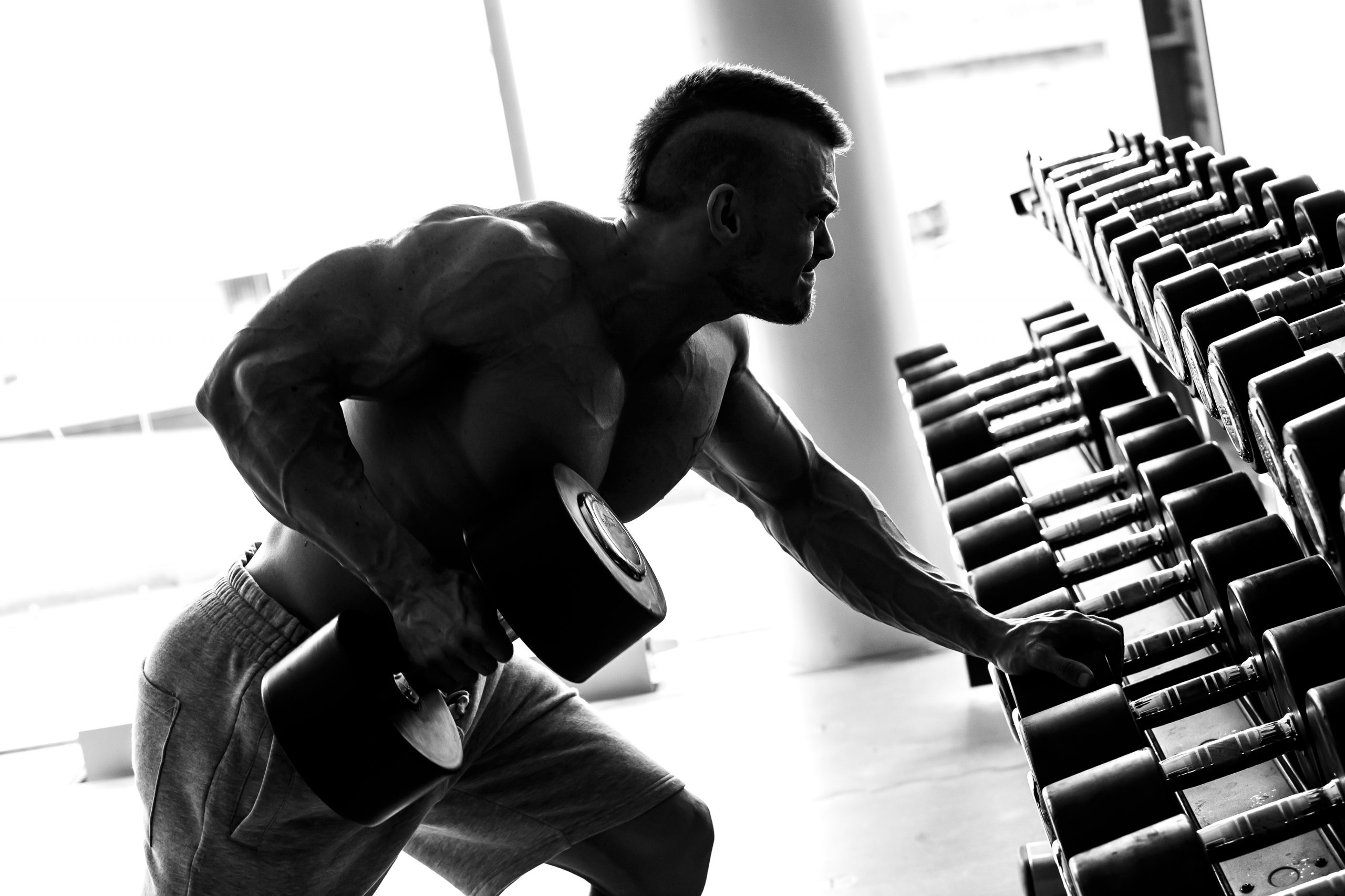 What are the effects of proper dumbbell rowing?